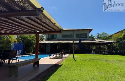 Linda casa 4 suítes, em condomínio frente mar bem próximo da vila !