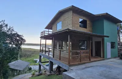 Casa com vista para lagoa na costa do macacu  próximo da cachoeira  garopaba sc
