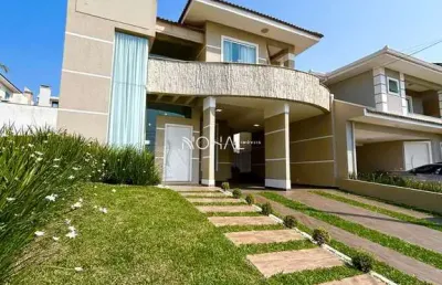 Casa em condomínio semimobiliada com 4 quartos (1 suíte)