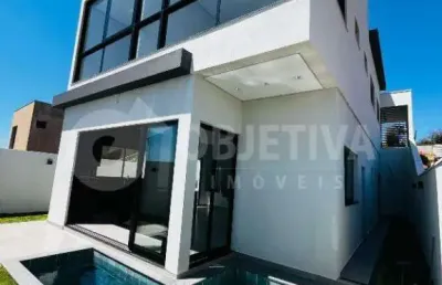 Magnífica casa de estilo sobrado a venda no condomínio terras alpha em uberlândia