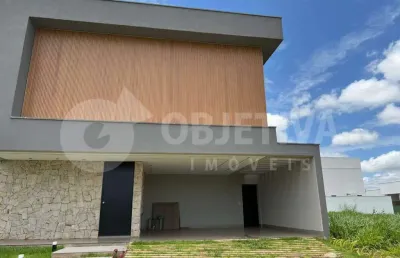 Belíssima casa nova de alto padrão localizada no condomínio tamboré uberlândia disponível para compra