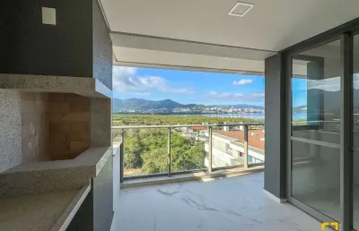 Apartamento novo com 3 suítes, sacada e vista para o mar - cacupé, florianópolis/sc