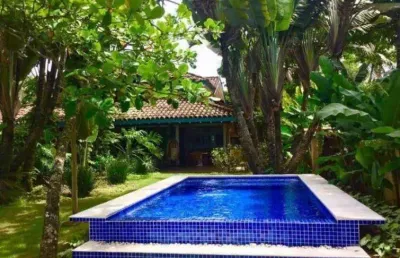 Casa pé na areia com piscina na praia de camburi em são sebastião