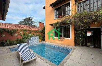 Casa à venda na praia do tombo | rocha imóveis guarujá