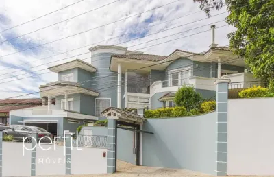 Sobrado a venda em condominio fechado com tres suites e um quarto no bairro saguaçu - joinville/ sc