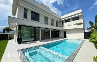 Sobrado a venda em condomínio fechado com 4 suítes e piscina no bairro pirabeiraba - joinville/ sc