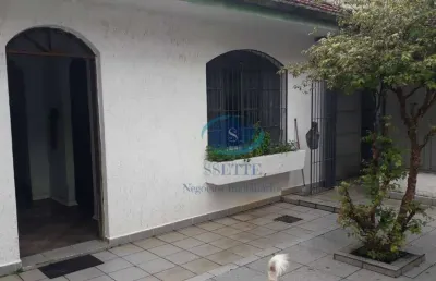 Casa térrea com 4 dormitórios,1 suíte,2 salas,4 banheiros,entrada lateral,4 vagas de garagem,aceita proposta.