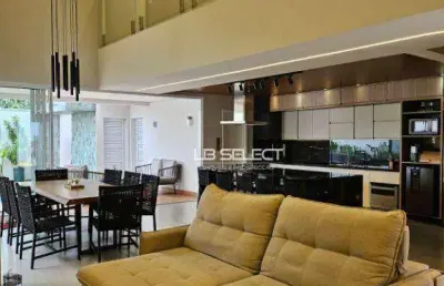 Casa alto padrão do condomínio raros com quatro suítes e varanda gourmet completa.