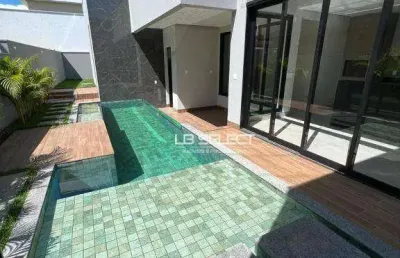 Casa no condomínio alphaville i com três suíte e área gourmet completa.