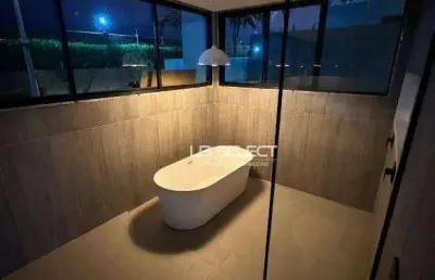 Casa no condomínio jardim gênova com quatro suítes, escritório com lavabo e área gourmet completa.