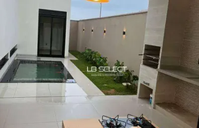 Casa no condomínio raros com três quartos e varanda gourmet.