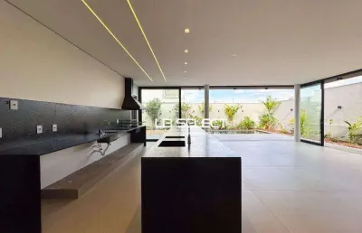 Casa no condomínio alphaville ii com quatro suítes e varanda gourmet completa.