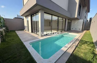Casa no condomínio tamboré com três suítes, uma semi suíte e varanda gourmet completa.