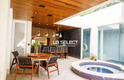 Casa no condomínio reserva do vale com quatro suítes e varanda gourmet completa.