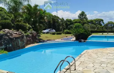 Terreno em condomínio fechado com 450m² acesso a piscinas e vista para o mar em antonina