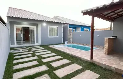 Casa com piscina e área gourmet em condomínio - unamar