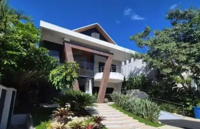 Magnífica casa mobiliada à venda alphaville barra da tijuca 800m² área útil terreno de 622m²  4 suítes todas com closets piscina sauna varanda gourmet