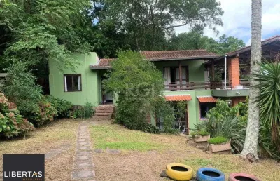 Terreno de 5.280 m², com 3 casas, no bairro ponta grossa, em porto alegre.