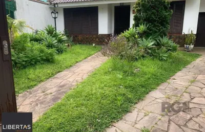 Casa com 3 quartos à venda na Rua Mura, 60, Guarujá, Porto Alegre