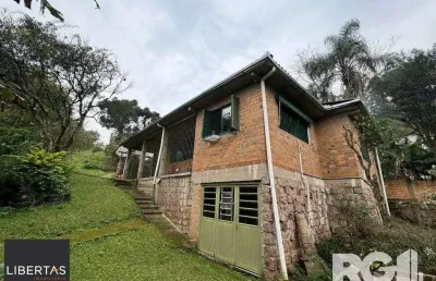 Casa com 3 quartos à venda na Rua dos Canudos, 358, Cascata, Porto Alegre