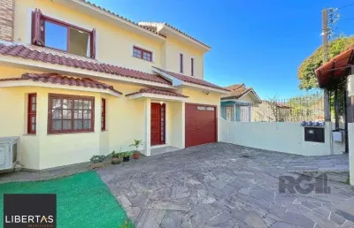 Casa com 3 quartos à venda na Avenida José Corrêa da Silva, 458, Cavalhada, Porto Alegre