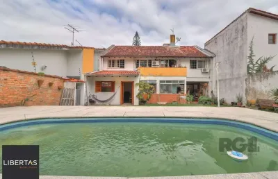 Casa a venda composta de 4 dormitórios no bairro jardim isabel em porto alegre