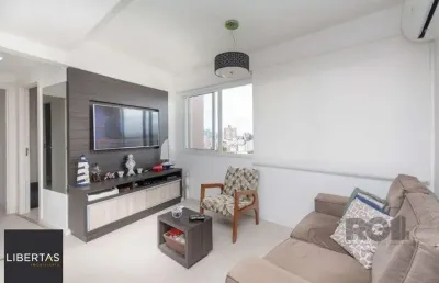 Apartamento andar alto que possui 2 dormitórios, sendo 1 súite, living para 2 ambientes, cozinha mobiliada, banheiro auxiliar