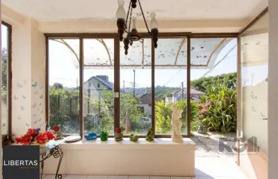 Casa com 2 quartos à venda na Rua Oscar Tollens, 242, Santa Tereza, Porto Alegre
