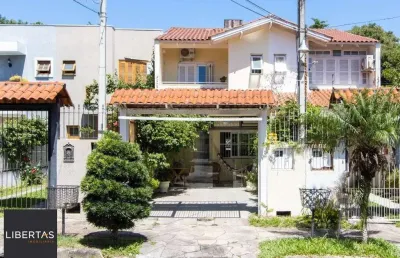 Casa com 3 quartos à venda na Rua Helio Felix Frey, 137, Espírito Santo, Porto Alegre