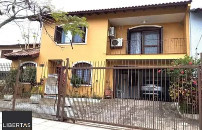Casa com 5 quartos à venda na Rua André Primo Biazetto, 414, Campo Novo, Porto Alegre