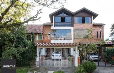 Casa com 3 quartos à venda na Rua Ponciano Pacheco da Silveira, 114, Guarujá, Porto Alegre