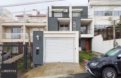 Casa com 3 quartos à venda na Rua Heitor Kramer, 680, Guarujá, Porto Alegre