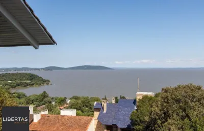 Casa deslumbrante vista do guaiba, 3 dormitórios, sendo 1 suite master com closet e banheira de hidro com vista para o rio