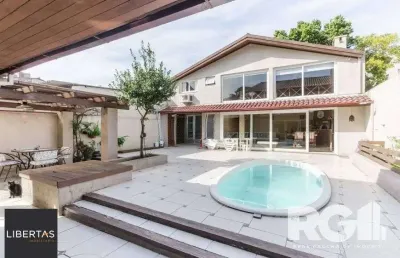 Casa com 5 quartos à venda na Rua Fernando Abbott, 100, Cristo Redentor, Porto Alegre