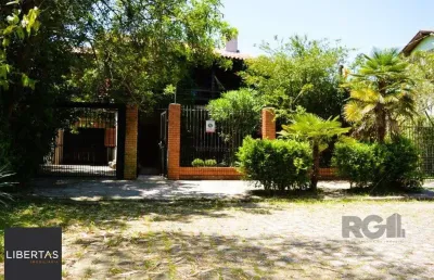 Magnífica mansão anos 90 a beira do guaíba na zona sul de porto alegre!