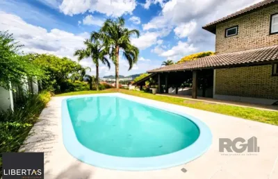Casa em condomínio fechado com 5 quartos à venda na Avenida Firmino Octávio Bimbi, 255, Cavalhada, Porto Alegre