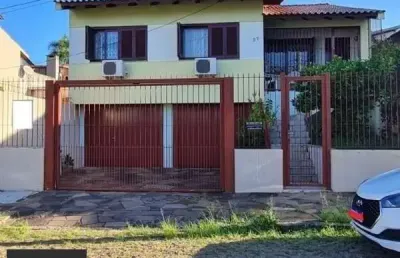 Casa com 4 quartos à venda na Rua Damasceno Vieira, 97, Partenon, Porto Alegre