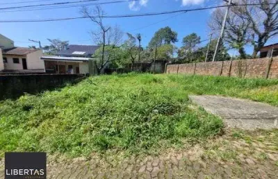 Terreno em condominio em porto alegre, no bairro vila nova, à venda.