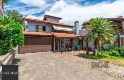 Casa com 4 quartos à venda na Rua Manoel Cabeda Perez, 63, Jardim Isabel, Porto Alegre