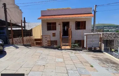 Casa com 2 quartos à venda na Rua Martim Minaberry, 405, Partenon, Porto Alegre