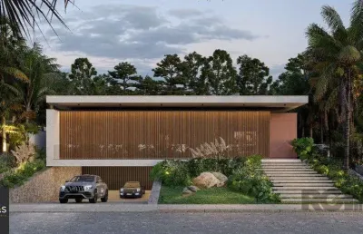 A casa conta com 434m2 de área construída, mas com um aproveitamento total dos 1.012m2 do lote