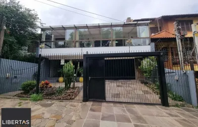 Casa com 3 quartos à venda na Rua Canto e Melo, 34, Nonoai, Porto Alegre