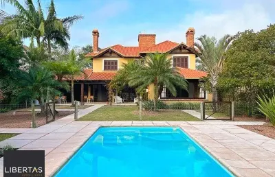 Terra ville - casa com 384 m² - fundo para o lago , semi mobiliada , com 3 suites e piscina .