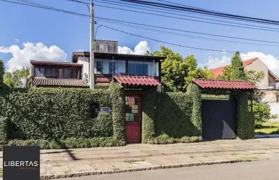 Casa com 3 quartos à venda na Avenida Guarujá, 140, Guarujá, Porto Alegre