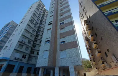 Compra 01 dormitório leva 02  em prédio frente mar no josé menino em santos