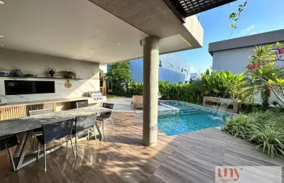 Casa luxuosa com 4 suítes e área de lazer privativa em condomínio fechado no bairro de intermares