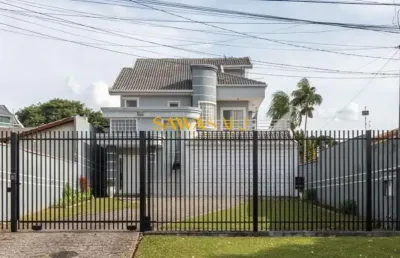 Sobrado alto padrão individual com frente para a rua no coração do guabirotuba contendo 5 quartos