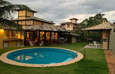 Vende casa em condomínio 04 suítes e area privativa com piscina e churrasqueira a 50m da praia de manguinhos