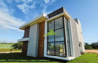 Casa à venda em guarajuba: 4 suítes, piscina com hidromassagem, área gourmet, nascente total, 192m² de área construída. condomínio canto de guarajuba.