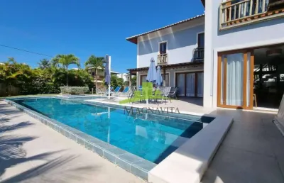 Casa de luxo em guarajuba com 8 suítes, piscina privativa e 100% climatizada no condomínio paraíso. lote de esquina, próxima à praia. segurança 24hs.